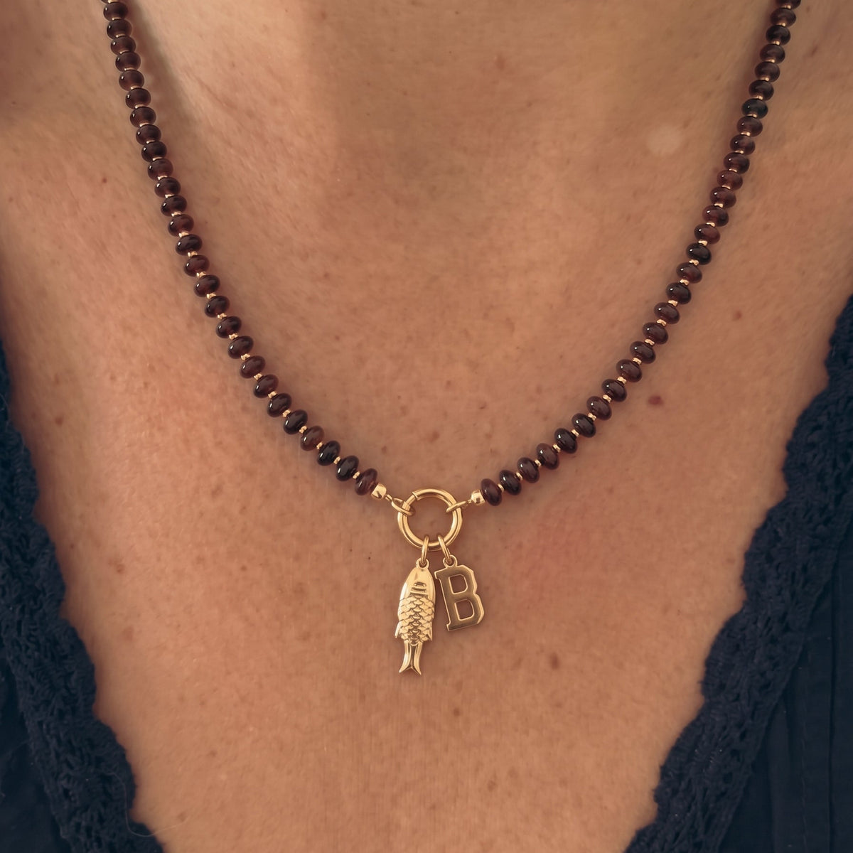fishy initial brown beaded necklace
