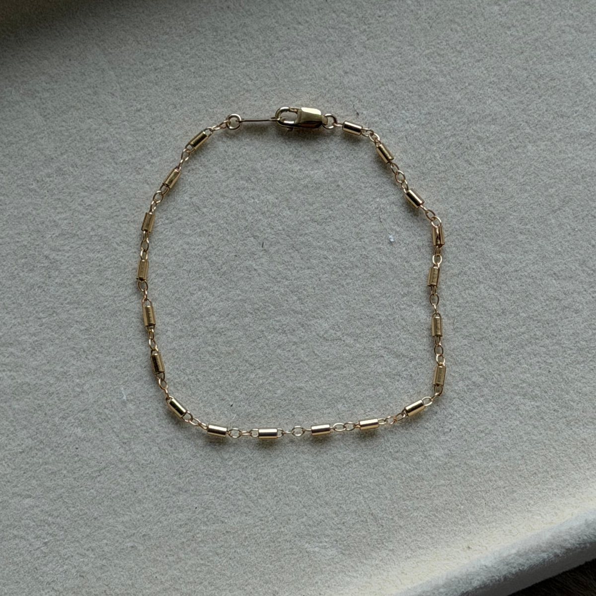 Cuffed by Nano LLC 14k gold filled tube chain bracelet with a delicate clasp, handmade from recycled metals.