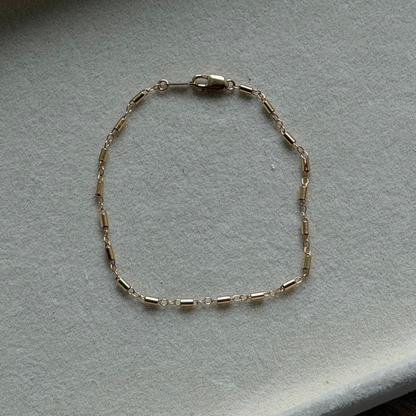 Cuffed by Nano LLC 14k gold filled tube chain bracelet with a delicate clasp, handmade from recycled metals.
